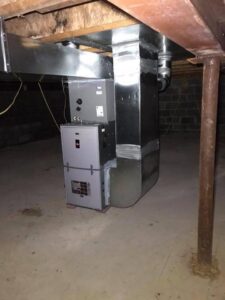 A complete HVAC system, including a furnace and extensive ductwork, professionally installed in a basement by Basurto's Heating & Cooling in Milwaukee, WI.
