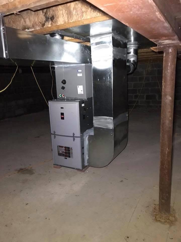 A complete HVAC system, including a furnace and extensive ductwork, professionally installed in a basement by Basurto's Heating & Cooling in Milwaukee, WI.