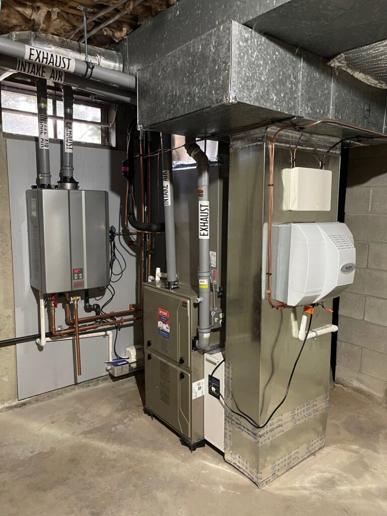 A complete HVAC system, including furnace, water heater, and ductwork, installed by C & C Temp Control in Worcester, MA.