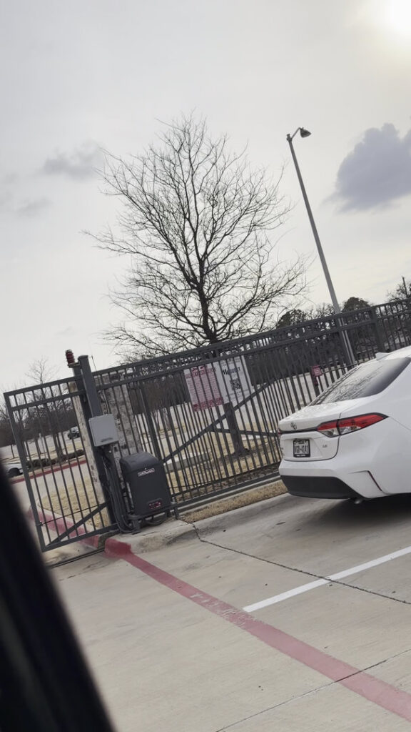 A completed automatic driveway gate providing secure access to a property, installed by A1 Security Gate & Intercom in Dallas, TX