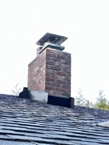 A completed brick chimney repair with a new cap, showcasing professional work by Five Star Chimney Repair in Hillsboro, OR.