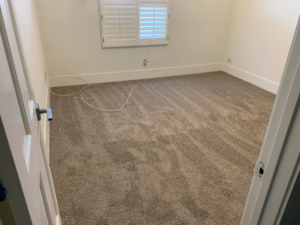 A completed brown carpet installation in a room, highlighting the professional service of Canyon State Flooring in Queen Creek, AZ.