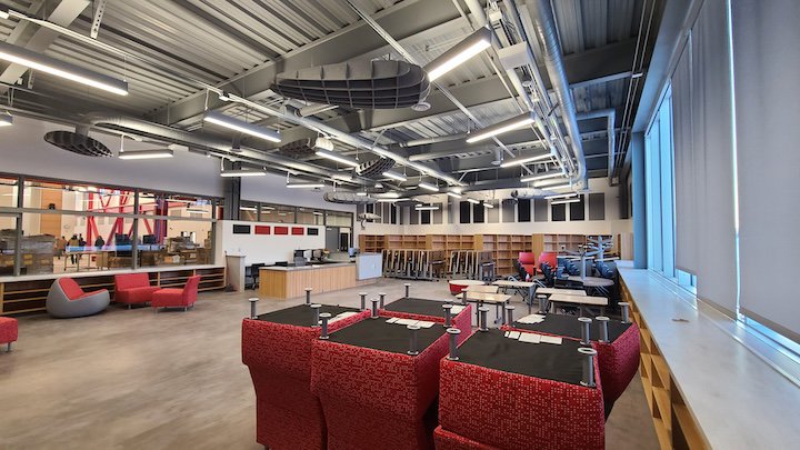 Modern commercial lighting installed in a spacious room, showcasing completed electrical work by Premier Electric LLC in Palmer, AK.