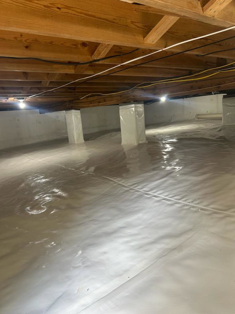 A wide view of a completed crawlspace encapsulation, ensuring a pest-free environment by Central Virginia Exterminating & Crawlspace Solutions in Dillwyn, VA.