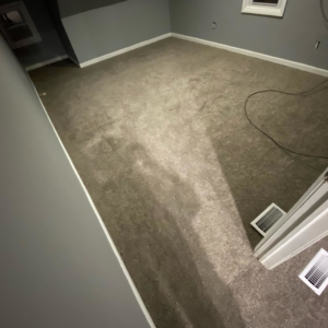 A bedroom with a completed grey carpet installation, showcasing the quality service of HK Carpet Doctors in Sterling Heights, MI