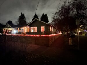 A beautifully completed horizontal slat fence with festive lights installed by Fence Repair Master in Vancouver, WA.
