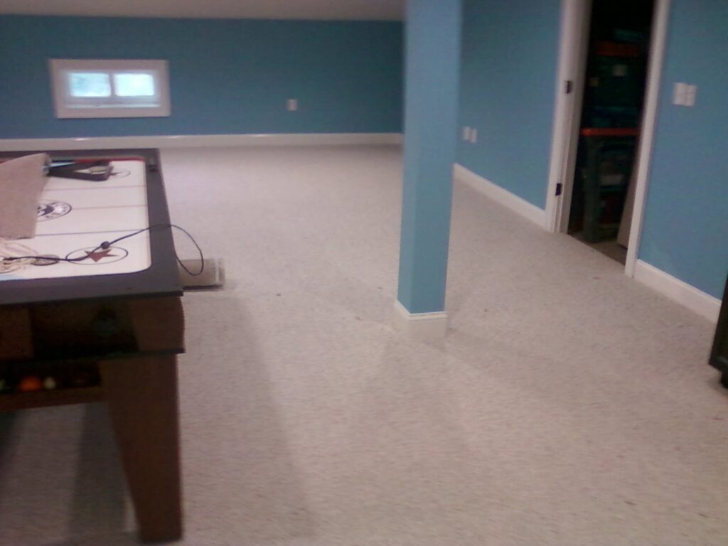 A spacious room with a newly completed light grey carpet installation by S&H Floor Covering in Cross Junction, VA.
