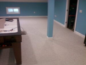 A spacious room with a newly completed light grey carpet installation by S&H Floor Covering in Cross Junction, VA.