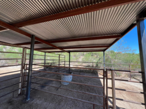 Completed interior of a metal fencing and shelter structure built by TACK Fabrication in Romero, Tucson, AZ.