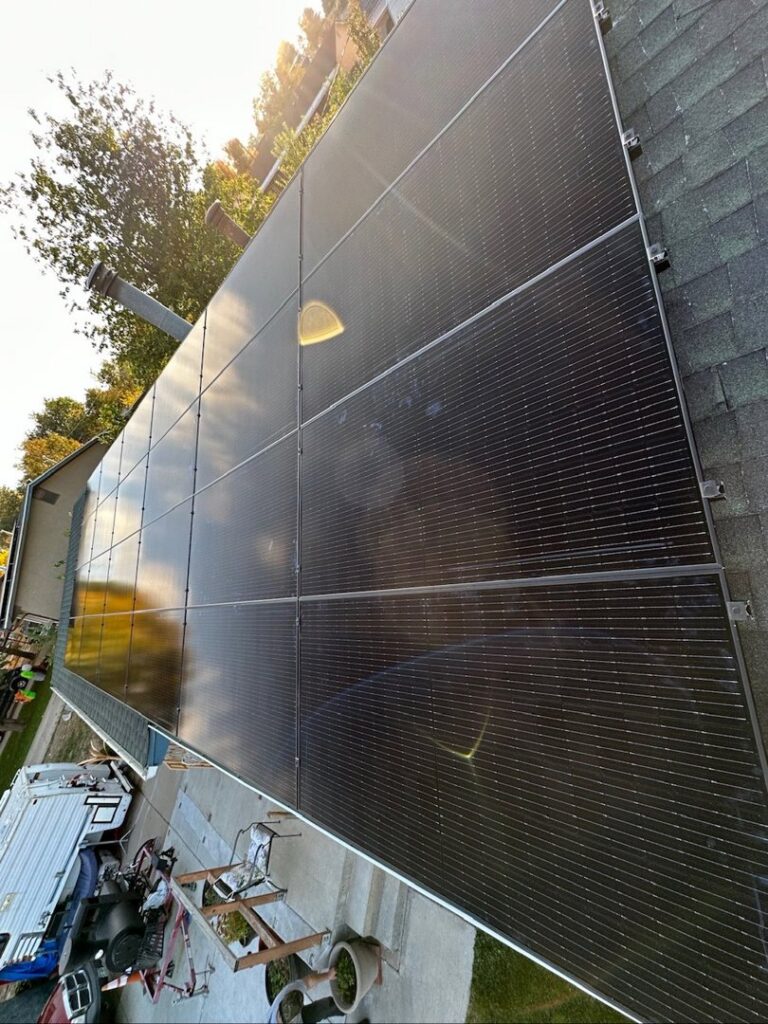 A close-up view of completed solar panel installation on a residential rooftop by Pueblo Electrics, Inc. in Pueblo, CO.