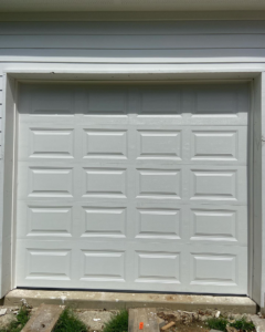 A completed installation of a white sectional garage door by J&C Bravo LLC, serving clients in Cordova, TN.