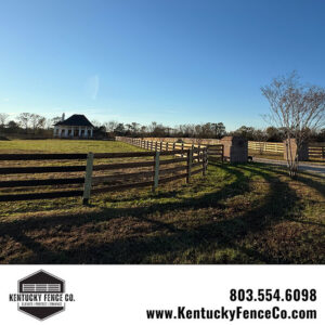 A completed wooden fence with a gate entrance and brick pillars installed by Kentucky Fence Co in McConnells, SC.