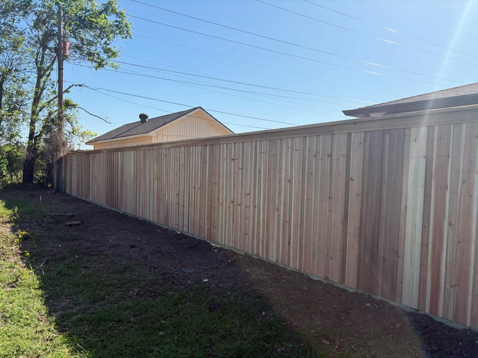 A long section of a newly installed wooden privacy fence completed by True Ways Services LLC in Mesquite, TX.