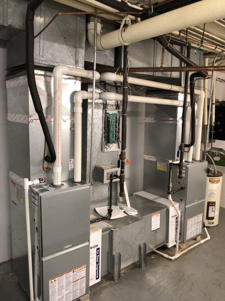 A complex commercial HVAC system installation with multiple units and ductwork by R.J. Nelson Co in Council Bluffs, IA.