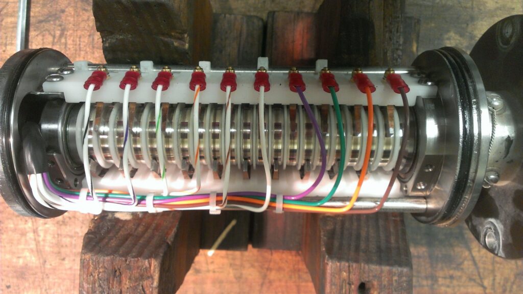 A complex electrical component with multiple wires connected, showcasing detailed electrical work by Mountain Electric in Knoxville, TN.