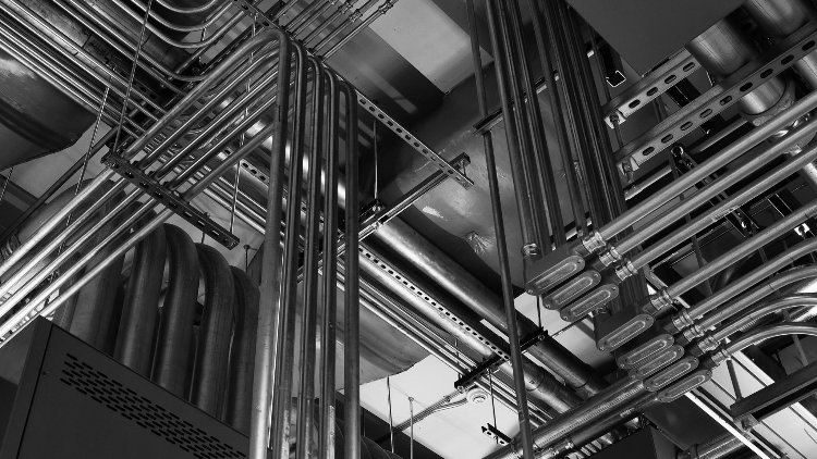 Intricate electrical conduit and wiring installed on a ceiling, showcasing expert work by RSL Electric LLC in York, PA.