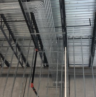 A complex commercial electrical conduit system installed on the ceiling by Tri-Area Electrical Construction in Cape Coral, FL.