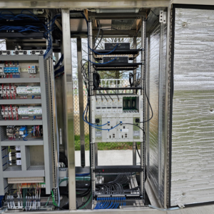 Intricate wiring and components inside a complex electrical and data cabinet, installed by ELEC LLC in Winston-Salem, NC.