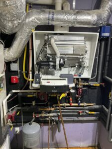 A complex heating system with extensive piping and ductwork installed by Heritage Home Service in Worcester, MA