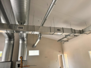 Complex HVAC duct system installation with various duct types by Buck'n Bull HVAC Solutions in Wilmington, NC