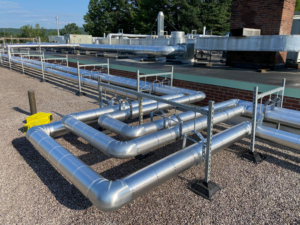 Complex network of insulated HVAC piping on a rooftop, installed by North Country Mechanical Insulators in South Burlington, VT.