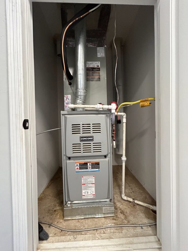 A Concord furnace and air handler unit newly installed in a closet by Bluestone Refrigeration LLC in Las Cruces, NM.