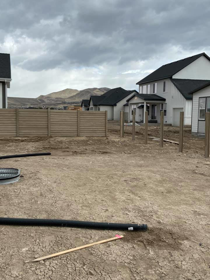 Concrete fence installation in progress with posts and panels being set by BroKrete Fencing LLC in Salt Lake City, UT