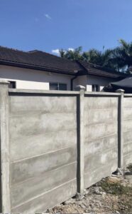 A durable concrete precast privacy fence installed by Palm's Fence of Miami, FL.