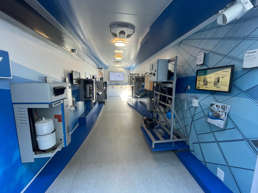 Interior view of a Condair mobile showroom displaying various HVAC equipment and systems, relevant to Stillwell-Hansen Inc. in Edison, NJ.
