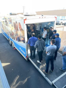 The Condair RoadShow trailer with a group of people gathered for an HVAC demonstration by Stillwell-Hansen Inc. in Edison, NJ.
