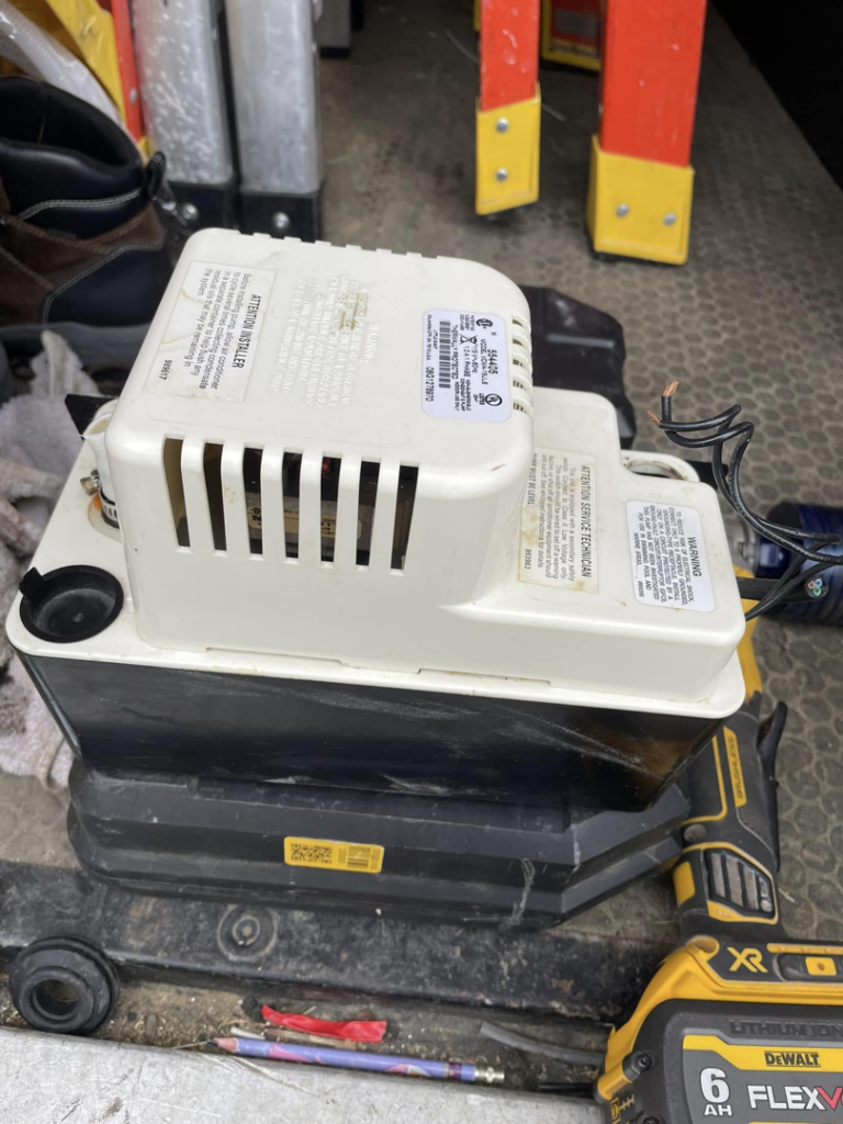 A condensate pump, a common component in HVAC systems, ready for service by Viking Mechanical LLC in Rapid City, SD.