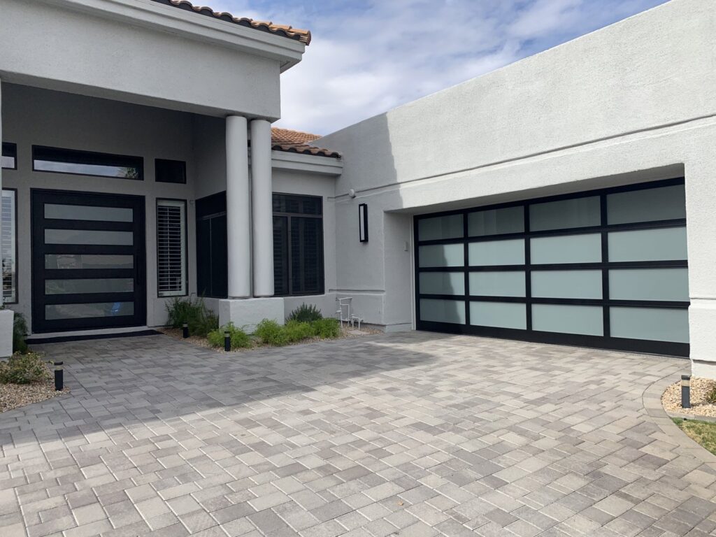 A contemporary frosted glass panel garage door installed by Blue Fox Garage Doors in Gilbert, AZ.