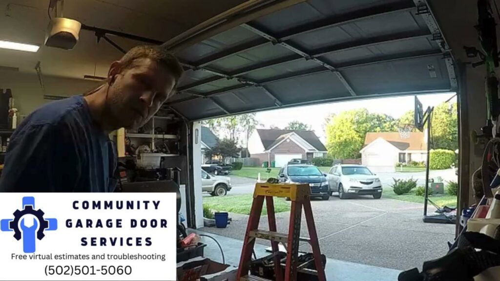 A contractor working on a garage door from the interior, with tools and a ladder, by Community Garage Door Services in Louisville, KY.