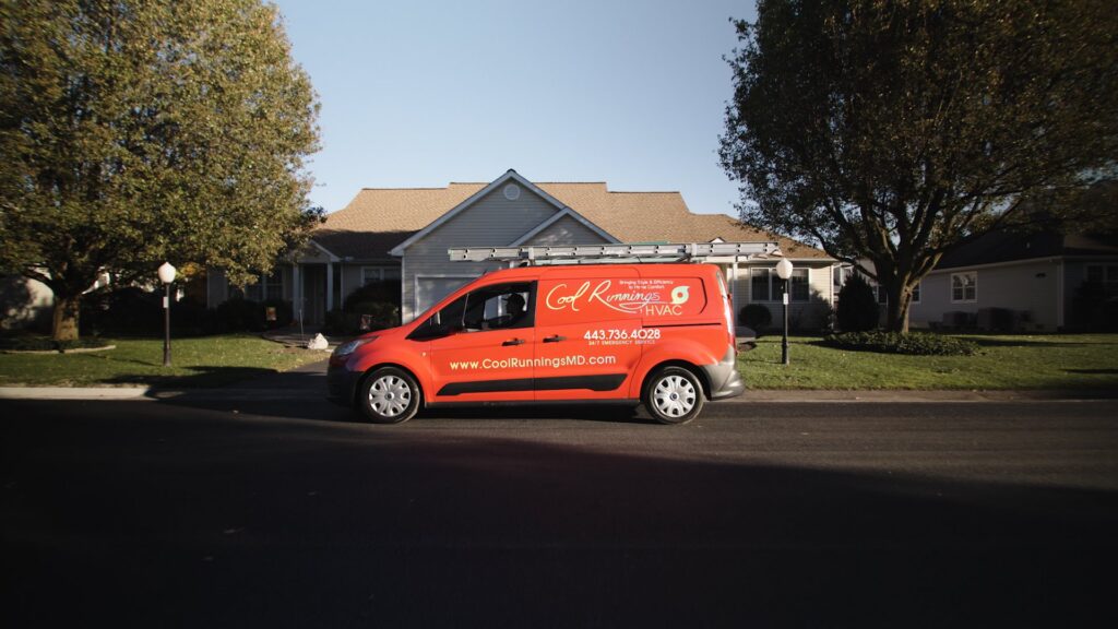 A Cool Runnings HVAC LLC service van parked in front of a residential home in Salisbury, MD, ready for an HVAC service call.