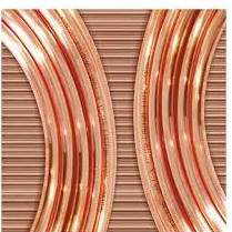 Close-up of copper refrigerant tubing, essential for HVAC systems, by DC AC Air Conditioning & Heating in San Diego, CA