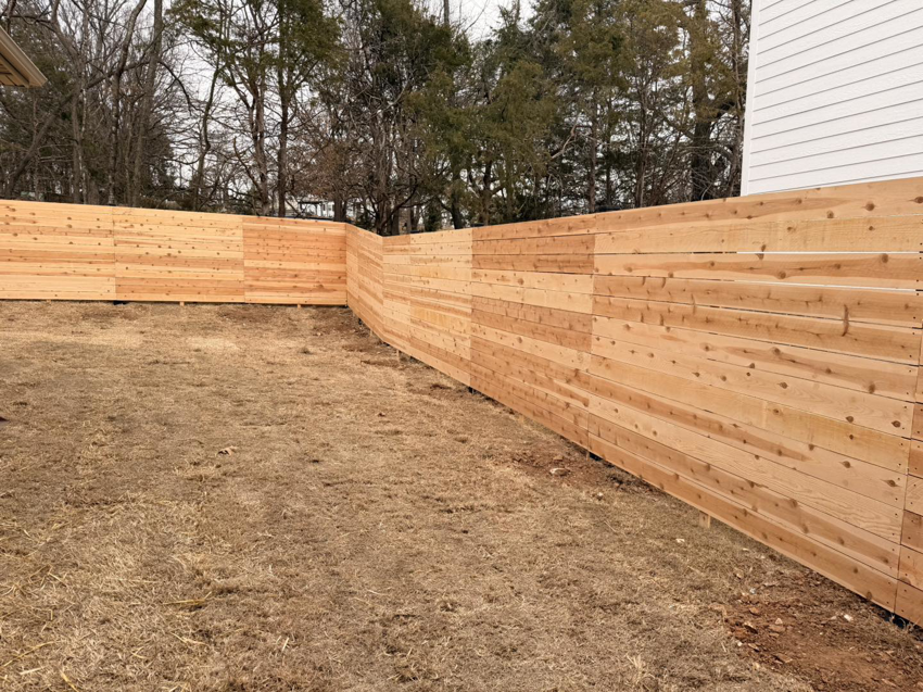 A corner section of a new wood privacy fence installed by Old School Fence Co. in Springfield, MO.