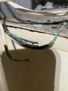 Severely corroded and damaged electrical wires requiring repair by Charging Rhino Electric in Mobile, AL