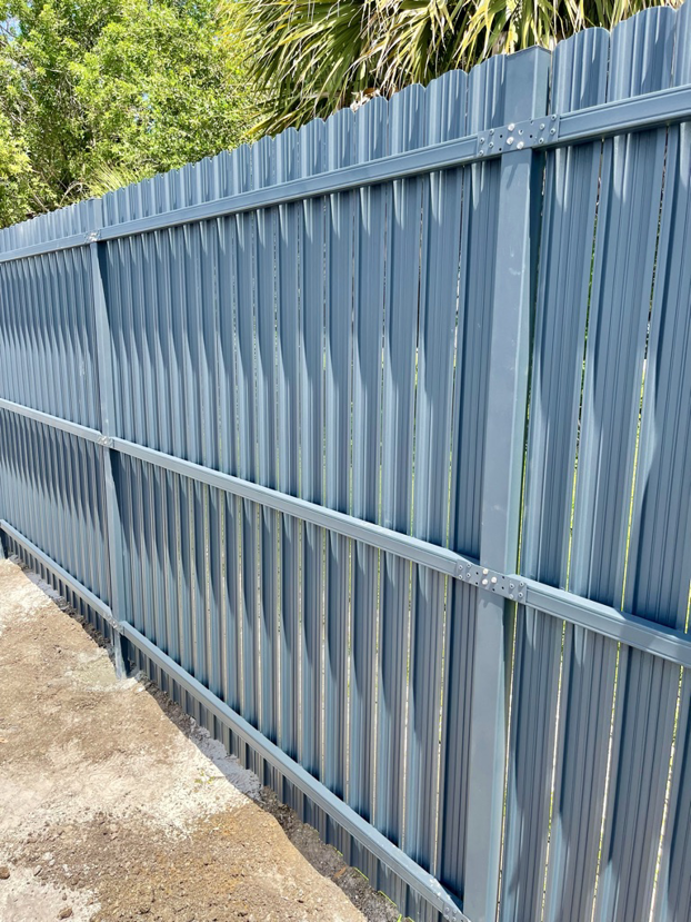 A newly installed light blue corrugated metal fence by New Euro Fences CA in Sacramento, CA.