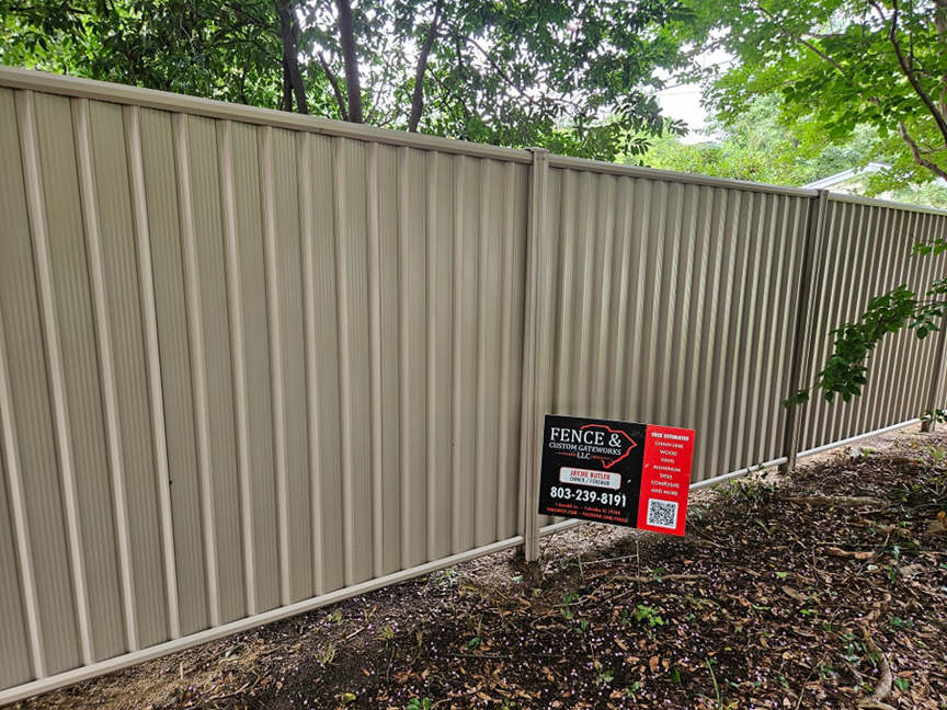 A newly installed corrugated metal privacy fence by Fence & Custom Gatework LLC in Columbia, SC