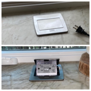 A modern countertop pop-up electrical outlet installed by Hammett Electric, Inc. in Conway, AR.