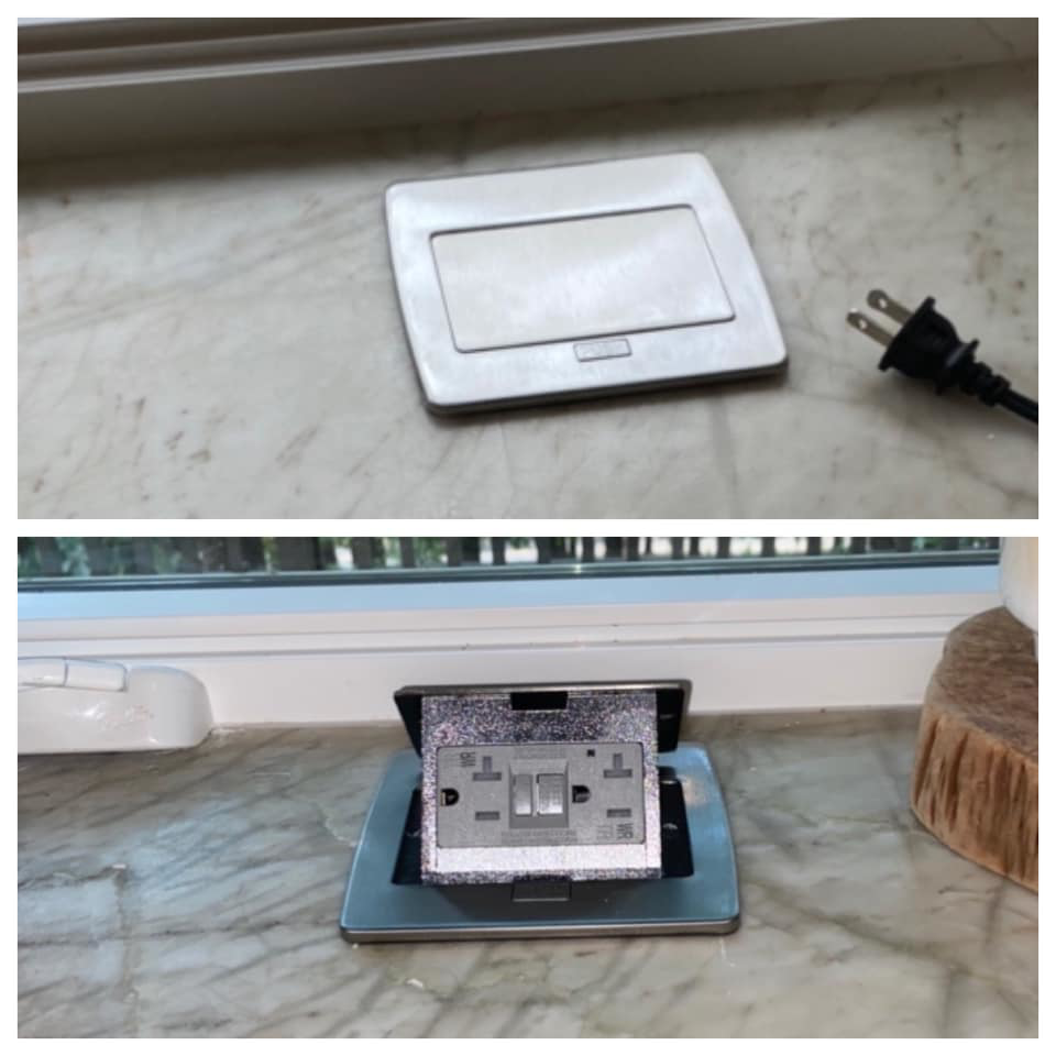 A modern countertop pop-up electrical outlet installed by Hammett Electric, Inc. in Conway, AR.