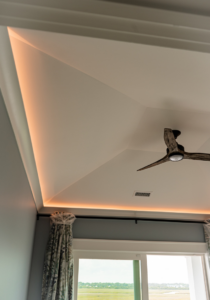 Custom cove lighting and a stylish ceiling fan installed by Anchor Electric LLC in Wilmington, NC