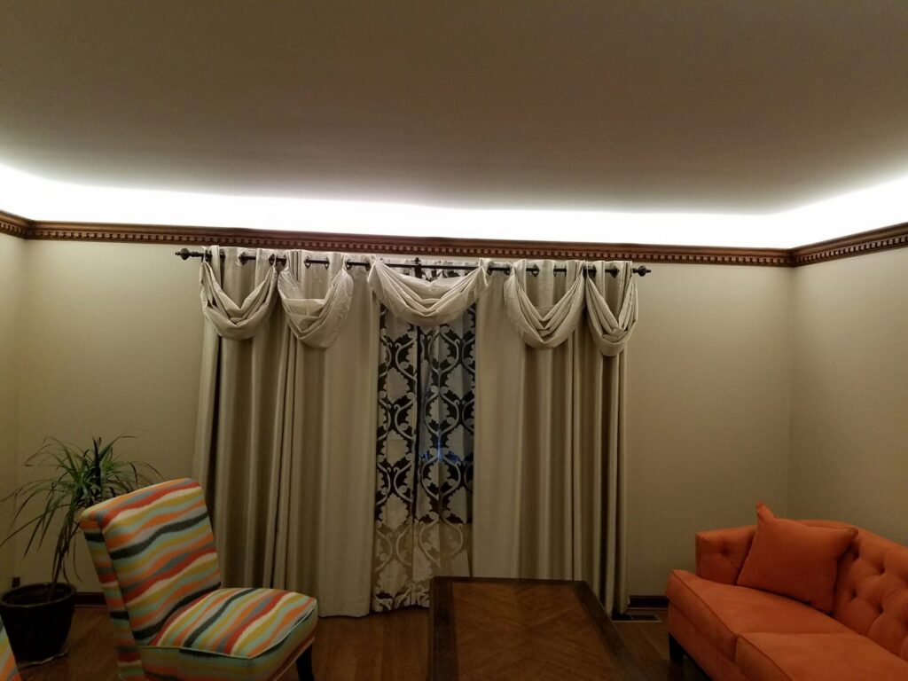 Modern cove lighting installed along the ceiling of a room by MDEC Electrical & Lighting in Livonia, MI.