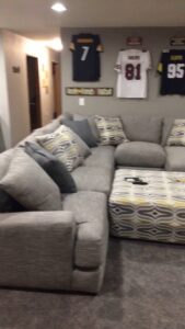 A cozy basement living area featuring a new carpet installation by Mozak's Floors & More in Yankton, SD