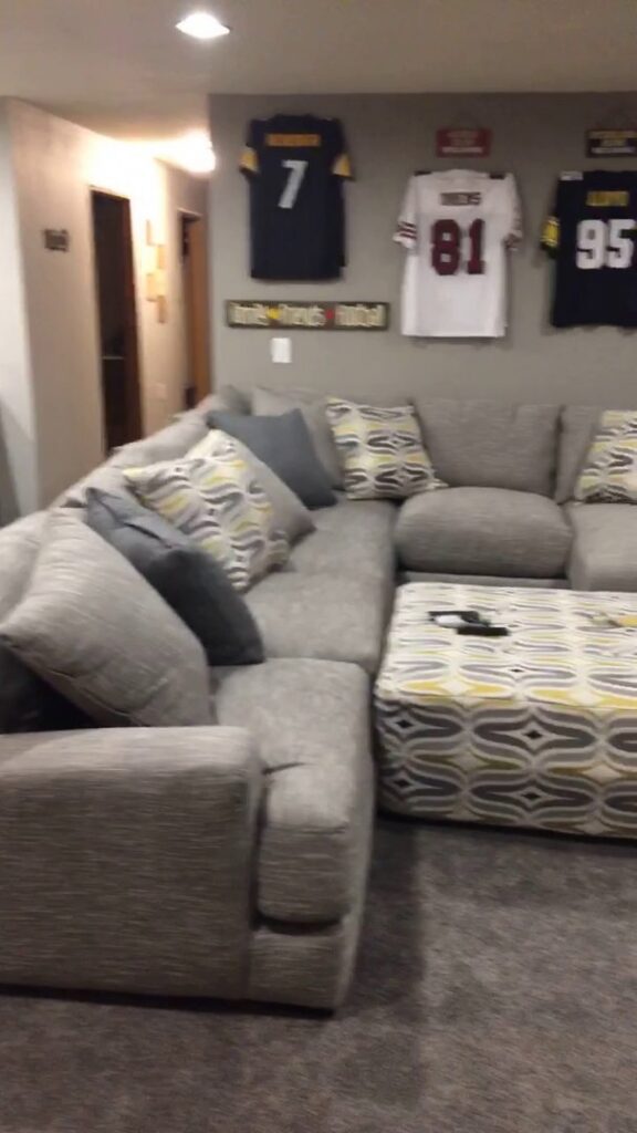 A cozy basement living area featuring a new carpet installation by Mozak's Floors & More in Yankton, SD