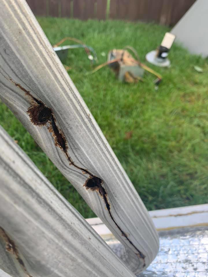 A close-up view of a cracked and corroded HVAC coil, indicating needed repair from Ammons Mechanical LLC in Durham, NC.