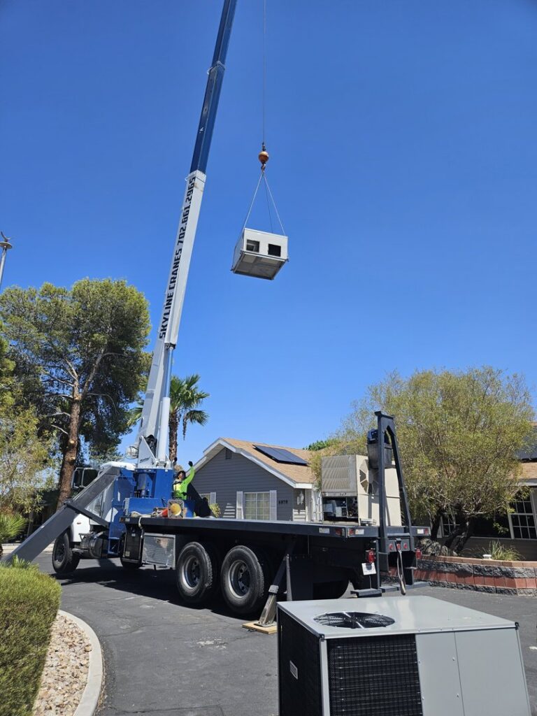 A crane lifting a new HVAC unit onto a residential roof for installation by Colton Air Conditioning - Las Vegas in Las Vegas, NV.