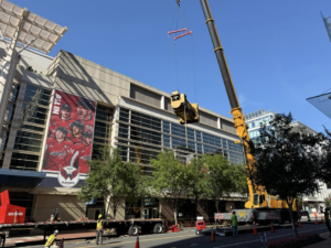 A large industrial generator being lifted by a crane for installation by RSL Electric LLC in York, PA.