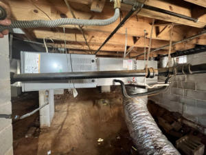 An HVAC air handler unit installed in a crawl space by Affordable heating and air conditioning in Meridian, MS.
