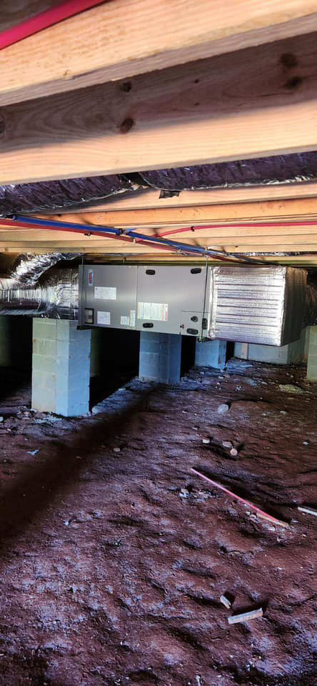 An HVAC air handler unit installed in a crawl space by R&R Heating and Cooling in Spokane, WA.